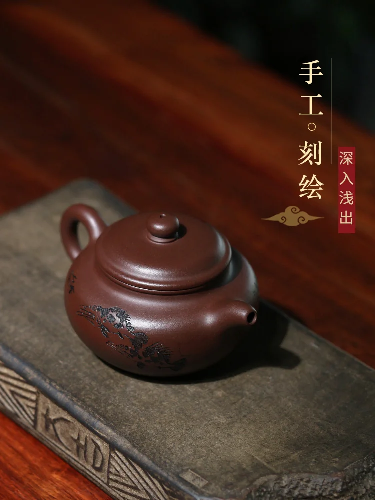 Upper view of the lid, spout and decorated teapot body